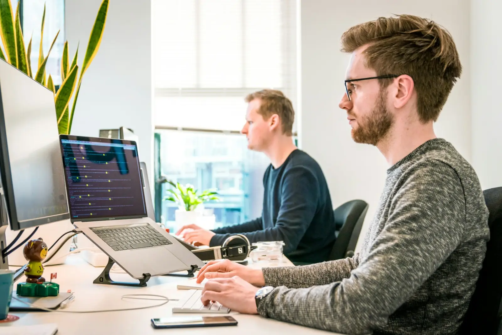 Our team collaborating at their desks